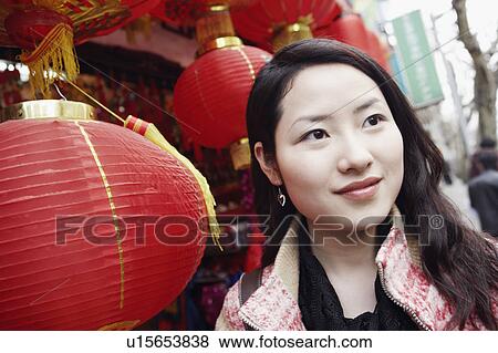 Stock Photo - Close-up of a young woman looking away. Fotosearch