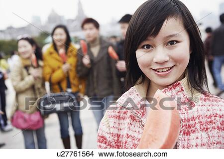 Portrait of a young woman holding a watermelon View Large Photo Image Picture - Portrait of a young woman holding a watermelon. Fotosearch