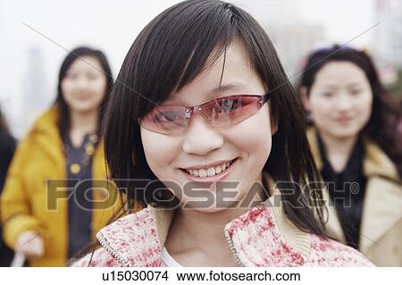 Picture - Portrait of a young woman smiling. Fotosearch
