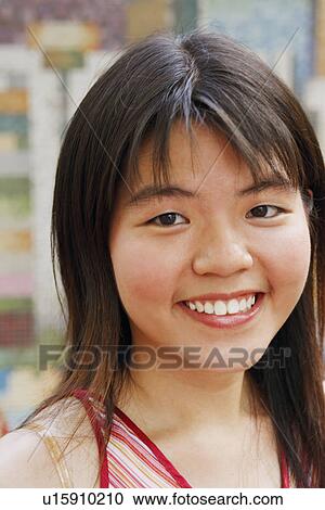 Portrait of a young woman smiling View Large Photo Image Stock Image - Portrait of a young woman smiling. Fotosearch