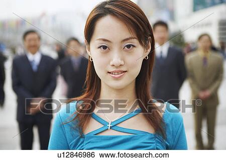 Stock Photograph - Portrait of a young woman smiling. Fotosearch