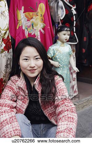 Stock Photograph - Portrait of a young woman smiling. Fotosearch