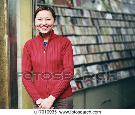 Stock Photography - Portrait of a young woman smiling. Fotosearch