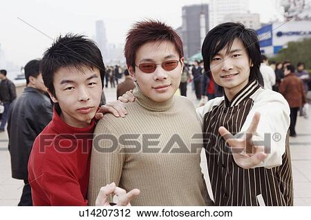 Portrait of three young men showing the peace sign View Large Photo Image Stock Image - Portrait of three young men showing the peace sign. Fotosearch
