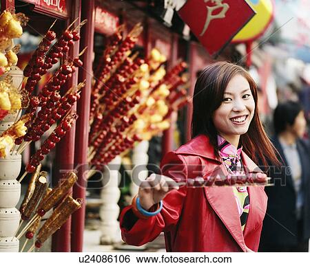 Stock Photograph - Portrait of young woman smiling. Fotosearch