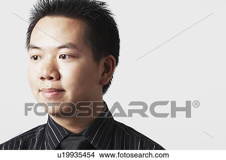 Picture - Close-up of a businessman looking away. Fotosearch