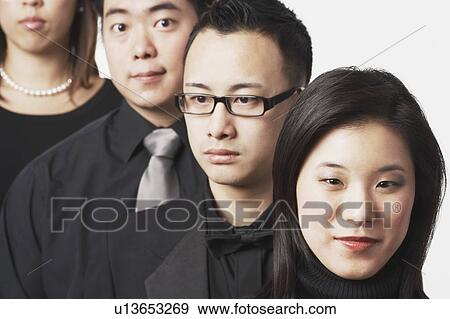 Stock Photo - Close-up of four people in a row. Fotosearch