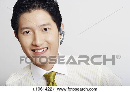 Portrait of a businessman smiling View Large Photo Image Stock Photo - Portrait of a businessman smiling. Fotosearch