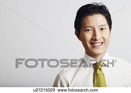 Stock Photo - Portrait of a businessman smiling. Fotosearch
