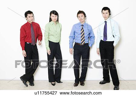 Portrait of four customer service representative standing together View Large Photo Image Stock Photo - Portrait of four customer service representative standing together. Fotosearch
