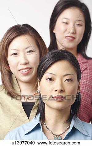 Portrait of three businesswomen smiling View Large Photo Image Stock Image - Portrait of three businesswomen smiling. Fotosearch