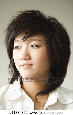 Close-up of a girl looking upset View Large Photo Image Stock Image - Close-up of a girl looking upset. Fotosearch