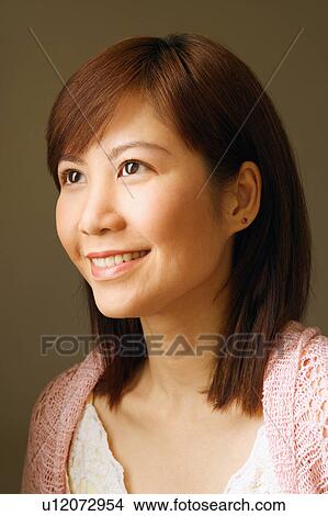 Picture - Close-up of a young woman smiling. Fotosearch