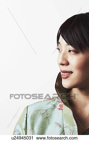 Close-up of a young woman smiling View Large Photo Image Stock Image - Close-up of a young woman smiling. Fotosearch