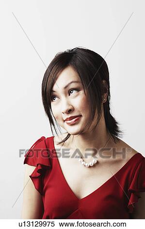 Close-up of a young woman smiling View Large Photo Image Stock Photography - Close-up of a young woman smiling. Fotosearch