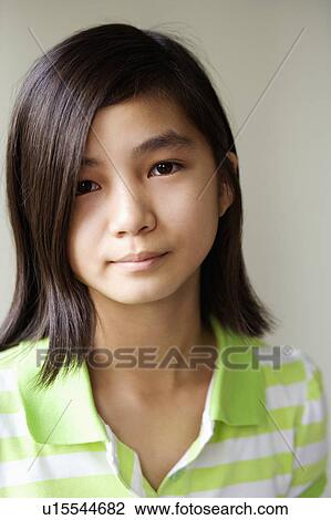 Stock Image - Portrait of a girl looking upset. Fotosearch