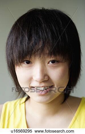 Stock Photography - Portrait of a girl smiling. Fotosearch