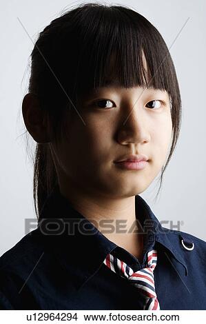 Portrait of a teenage girl thinking View Large Photo Image Picture - Portrait of a teenage girl thinking. Fotosearch