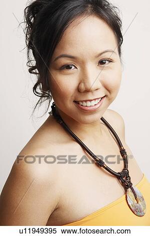 Stock Photography - Portrait of a young woman smiling. Fotosearch