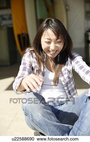 Young woman smiling View Large Photo Image Stock Image - Young woman smiling. Fotosearch