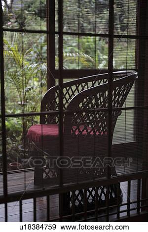 Close-up of a chair through blinds View Large Photo Image Stock Photo - Close-up of a chair through blinds. Fotosearch