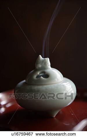 Stock Photo - Close-up of white incense burner. Fotosearch