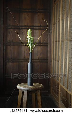 Stock Image - Front view of a flower vase on a table. Fotosearch