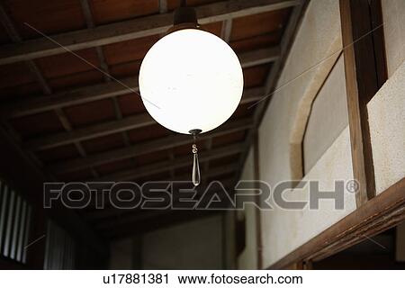 Stock Image - Low angle view of a designed lamp. Fotosearch