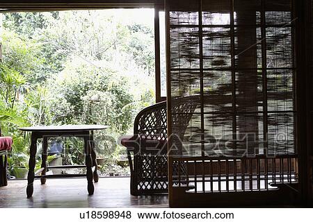 Stock Photo - View of seating arrangement in a porch. Fotosearch