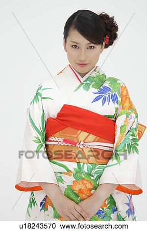 Stock Image - Portrait of a teenage girl in traditional outfit. Fotosearch