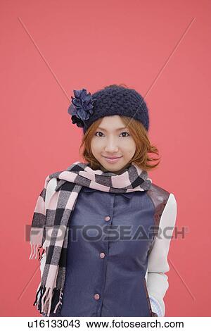 Stock Image - Portrait of a teenage girl wearing a muffler. Fotosearch