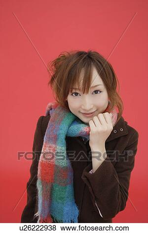 Stock Photo - Portrait of a teenage girl wearing a muffler. Fotosearch
