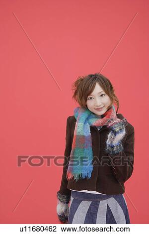 Stock Image - Portrait of a teenager girl wearing a muffler. Fotosearch