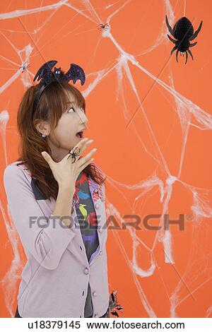 Stock Photography - Portrait of teenage girl with a conical hat. Fotosearch