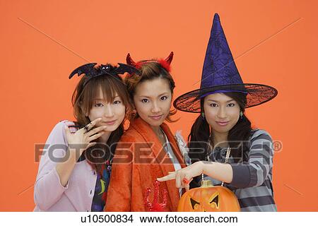 Teenage girls with jack-o-lantern View Large Photo Image Picture - Teenage girls with jack-o-lantern. Fotosearch