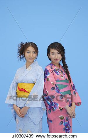 Stock Photo - View of teenage girls in traditional outfits. Fotosearch