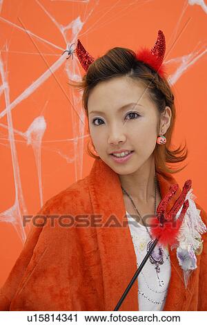 Close-up of teenage girl with a trident View Large Photo Image Stock Image - Close-up of teenage girl with a trident. Fotosearch