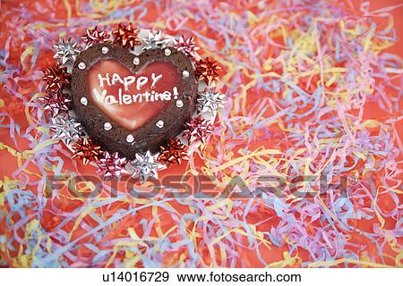 Stock Photo - High angle view of a heart-shaped cake. Fotosearch