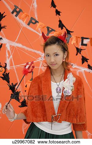 Stock Image - Portrait of a teenage girl with a trident. Fotosearch