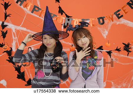 Stock Photo - Portrait of teenage girls wearing fancy dress. Fotosearch