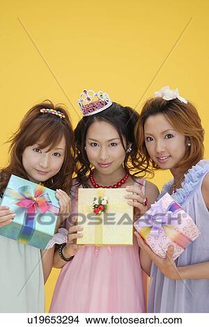Portrait of teenage girls with gift boxes View Large Photo Image Picture - Portrait of teenage girls with gift boxes. Fotosearch
