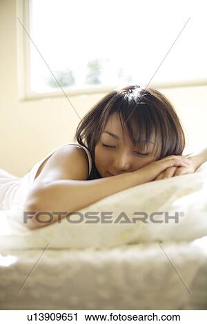 Young woman sleeping View Large Photo Image Stock Image - Young woman sleeping. Fotosearch