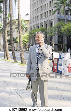Businessman using mobile phone View Large Photo Image Stock Image - Businessman using mobile phone. Fotosearch