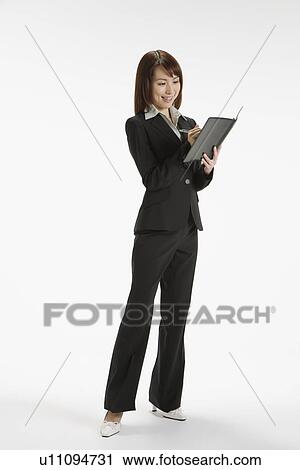 Cheerful executive holding a file, portrait View Large Photo Image Stock Image - Cheerful executive holding a file, portrait. Fotosearch