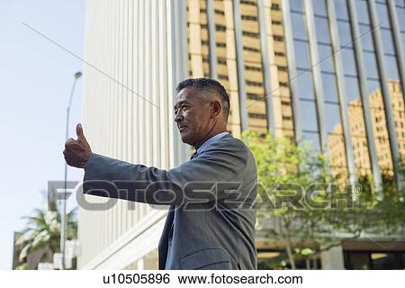 Mature man showing thumb View Large Photo Image Stock Photograph - Mature man showing thumb. Fotosearch