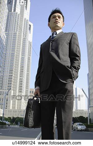 Picture - Low angle view of a businessman. Fotosearch