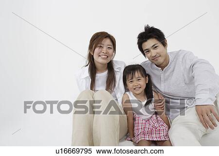 Stock Photography - A young couple with a girl. Fotosearch