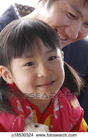 Portrait of a girl with father in Yukata, smiling, close up View Large Photo Image Picture - Portrait of a girl with father in Yukata, smiling, close up. Fotosearch