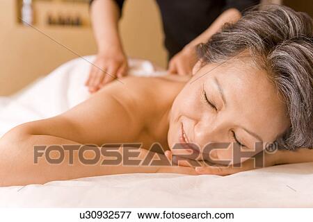 Senior woman taking massage, closing eyes View Large Photo Image Stock Photo - Senior woman taking massage, closing eyes. Fotosearch