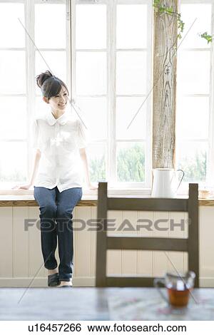 Stock Photograph - A Young Woman. Fotosearch